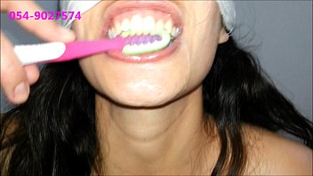 sharon from tel-aviv brushes her teeth.