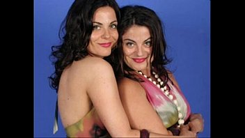 identical sapphic twins posing together and.